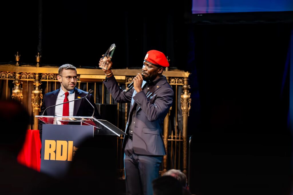 Award presentation on stage at an RDI event